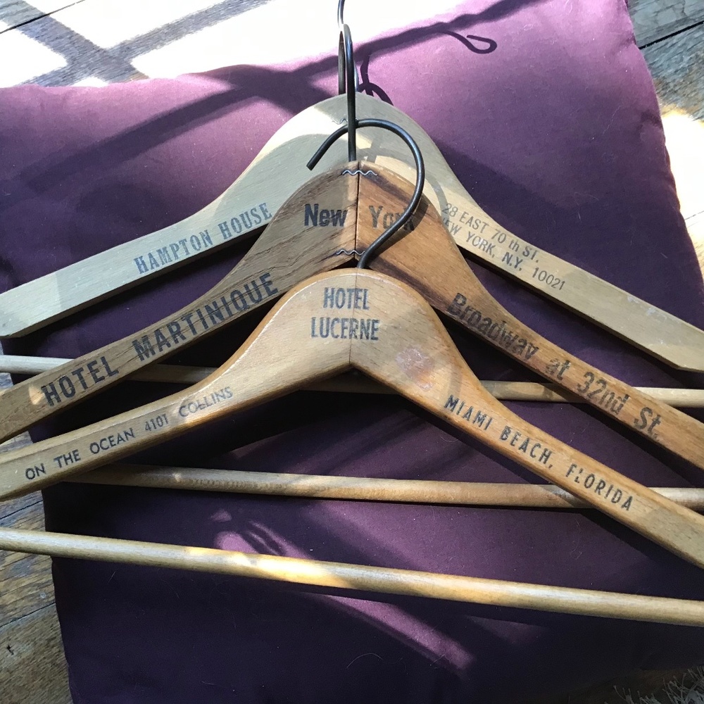 Three rare vintage hotel wooden hangers.